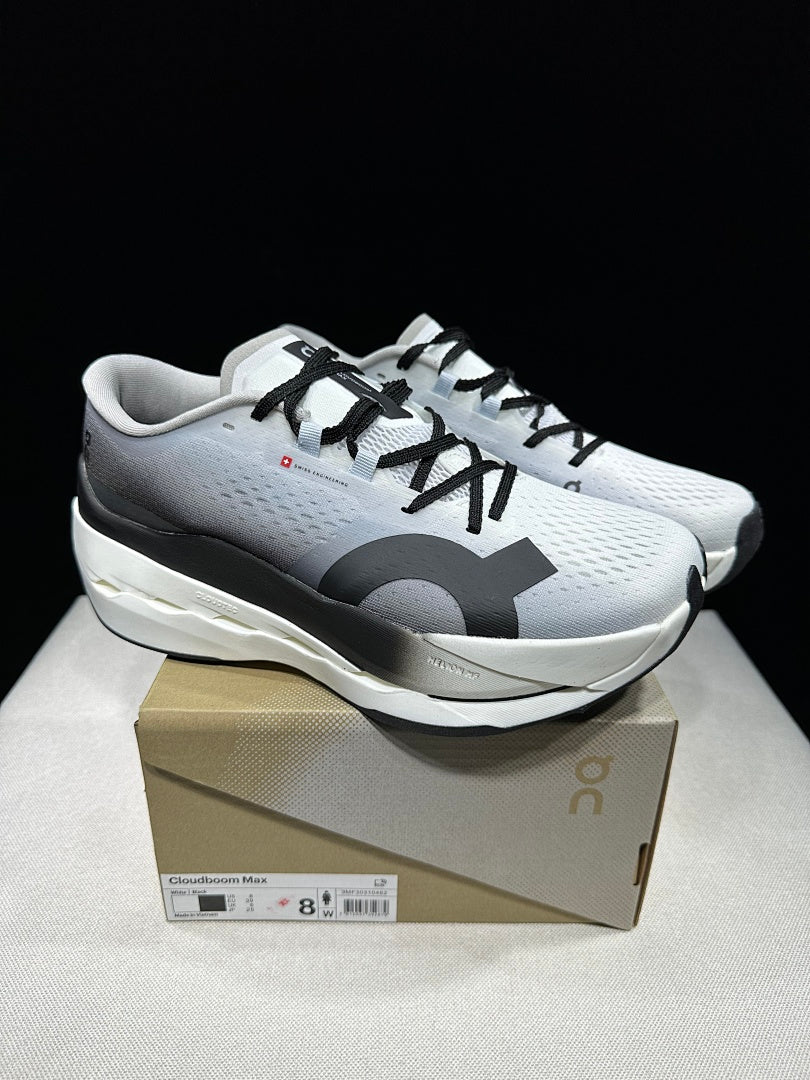 On Cloudboom Max Running Shoes, in White and Black - product image from the listing.