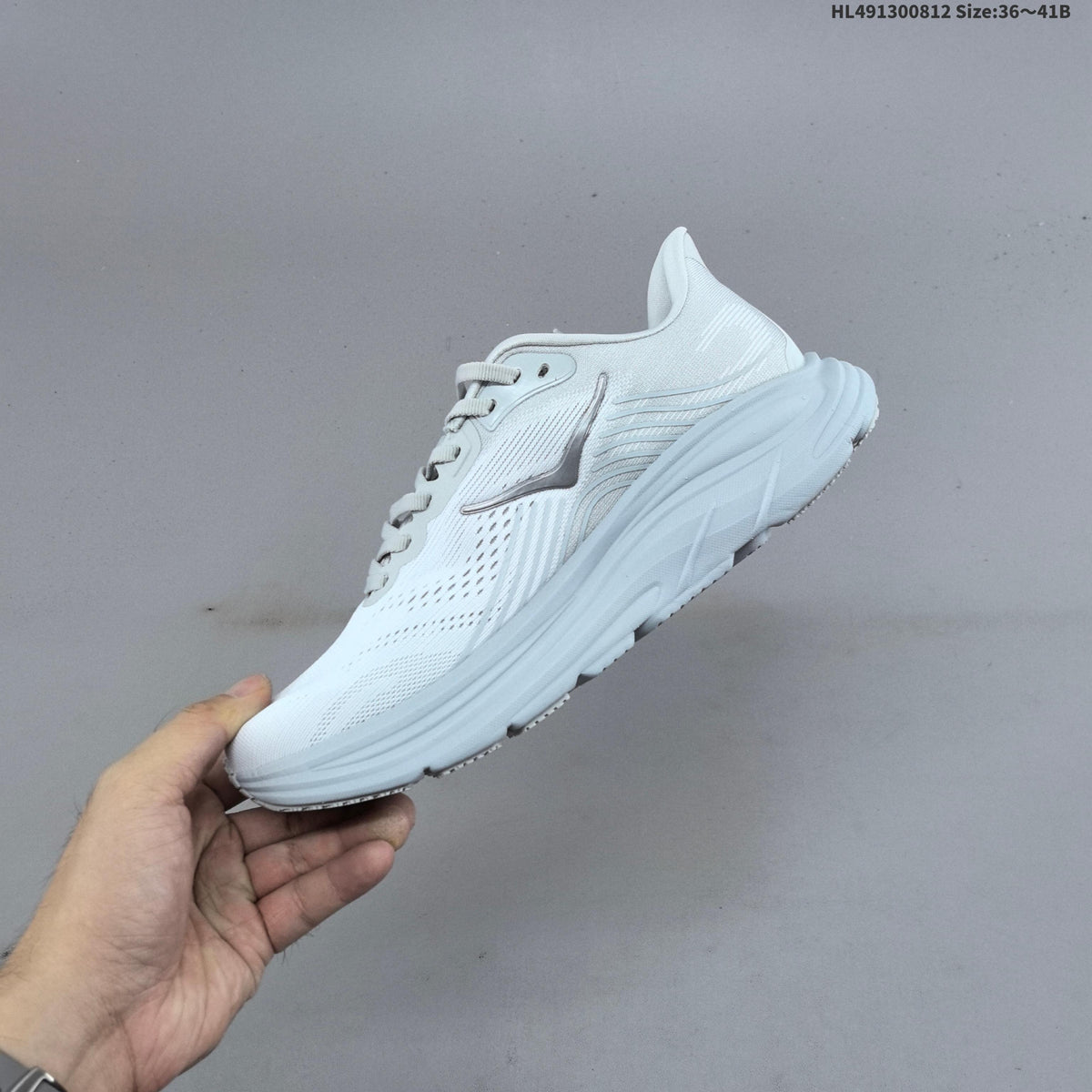 HOKA Clifton 11 Running Shoes in White - product image from the listing.
