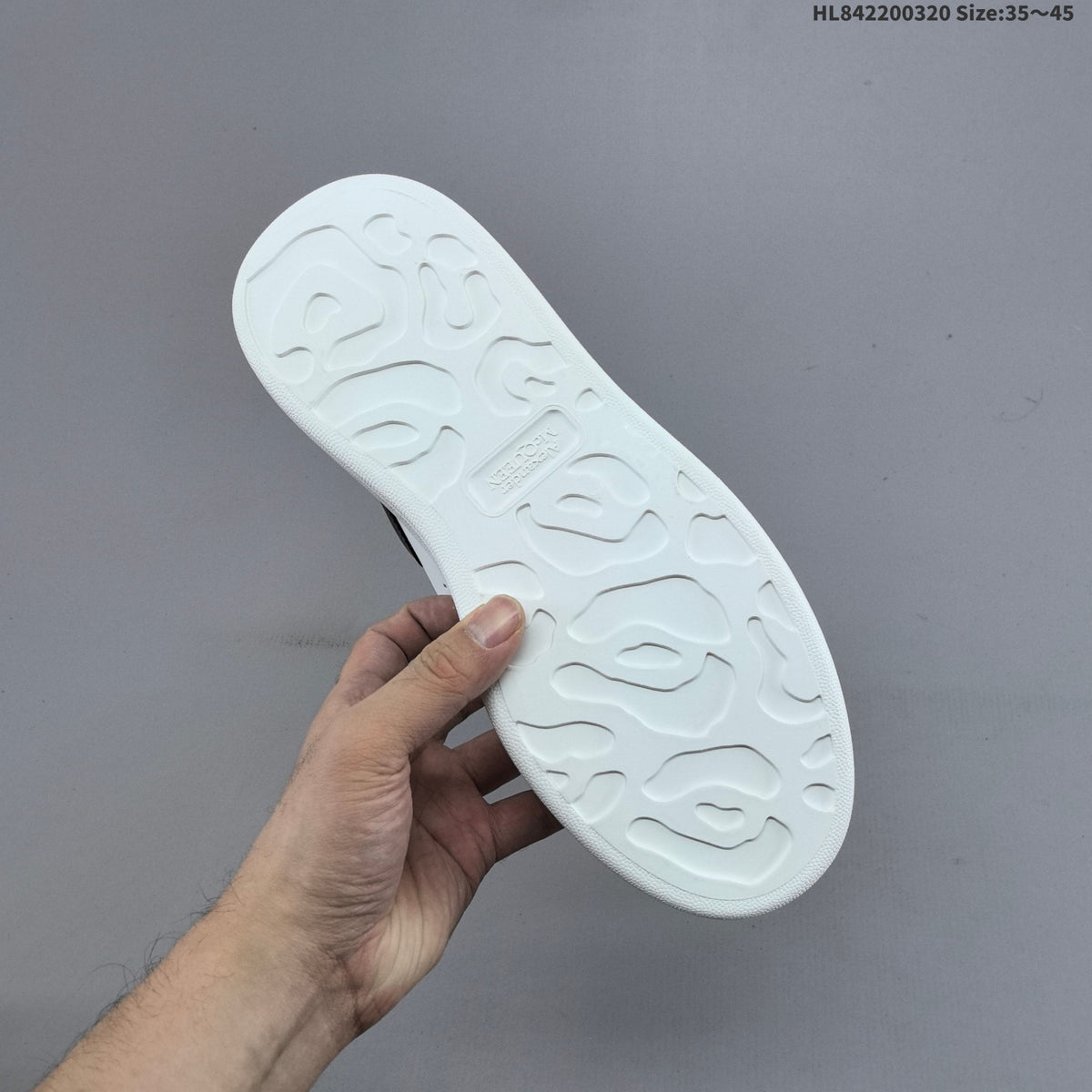 Alexander McQueen Oversized Low-Top Sneakers, in White and Black - product image from the listing.