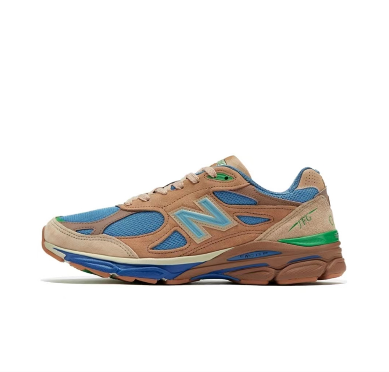 New Balance M990JG3 990v3 Sneakers, in Tan and Blue - product image from the listing.