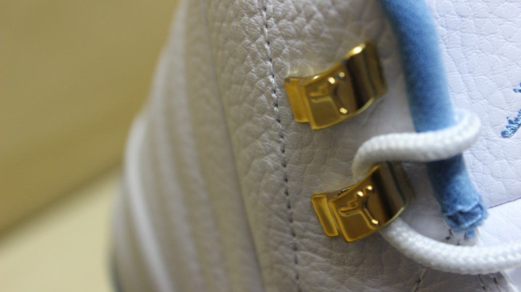 Air Jordan 12 High-Top Sneakers in University Blue 510815-127 - product image from the listing.
