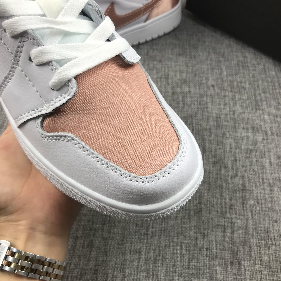 Women's Jordan 1 Mid Rose Gold Silk Sneakers 555112-190 - product image from the listing.