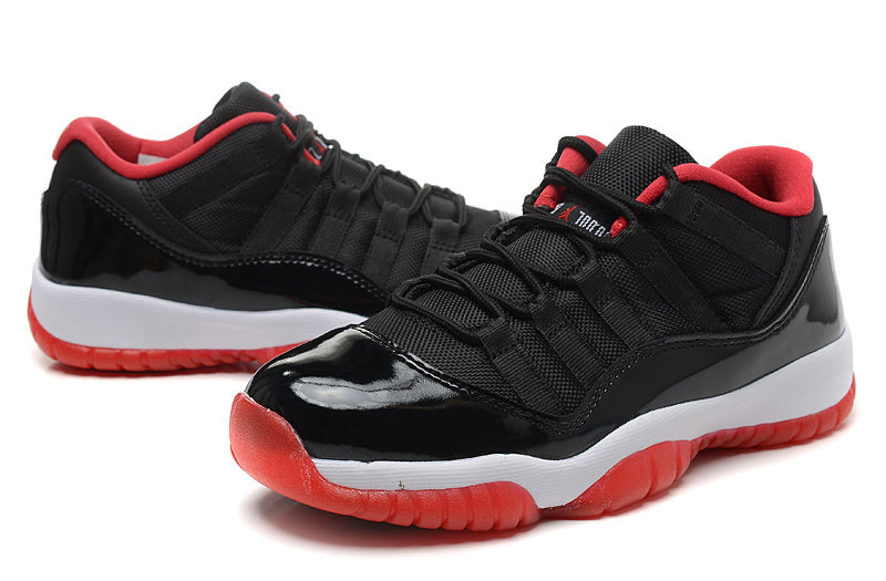 Air Jordan 11 Retro Low Black Red Sneakers - product image from the listing.