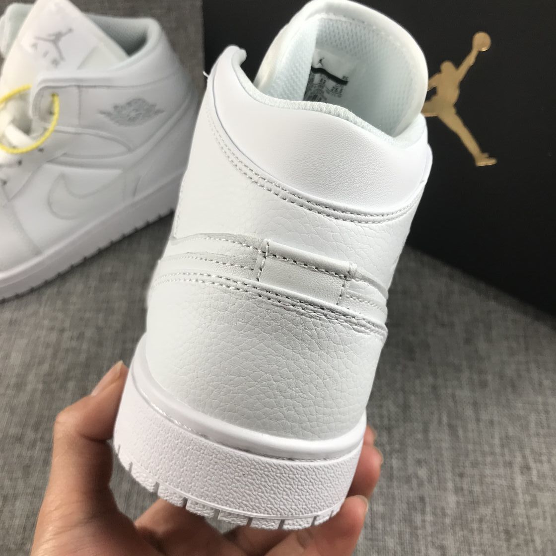 Air Jordan 1 Mid Sneakers in White - product image from the listing.