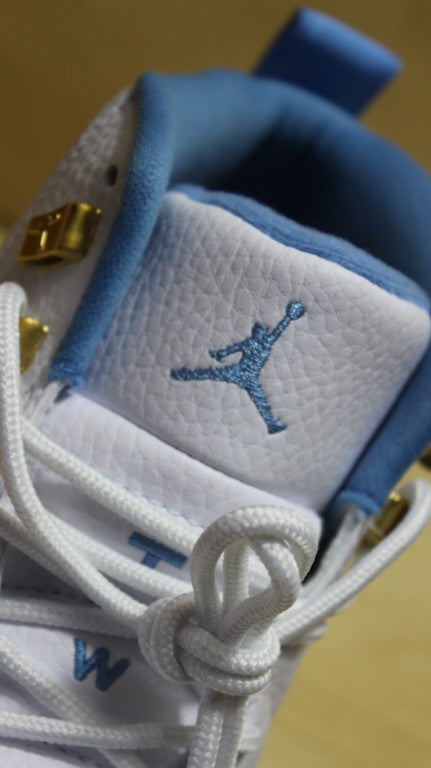 Air Jordan 12 High-Top Sneakers in University Blue 510815-127 - product image from the listing.