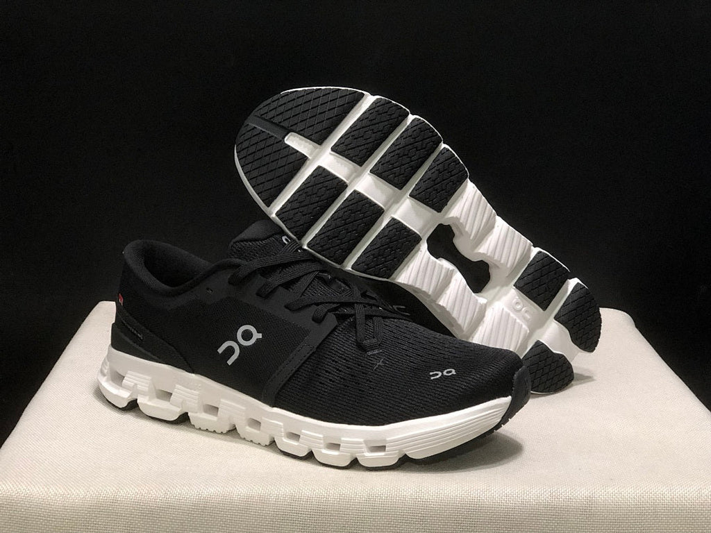 On Cloud X 4 Sneakers in Black and White - product image from the listing.