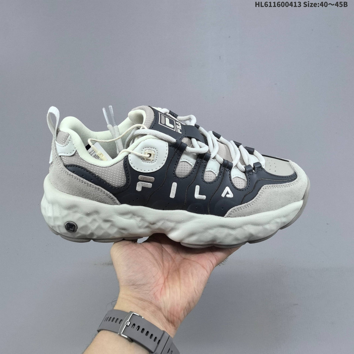 Cream and Charcoal FILA Chunky Sole Sneakers - product image from the listing.