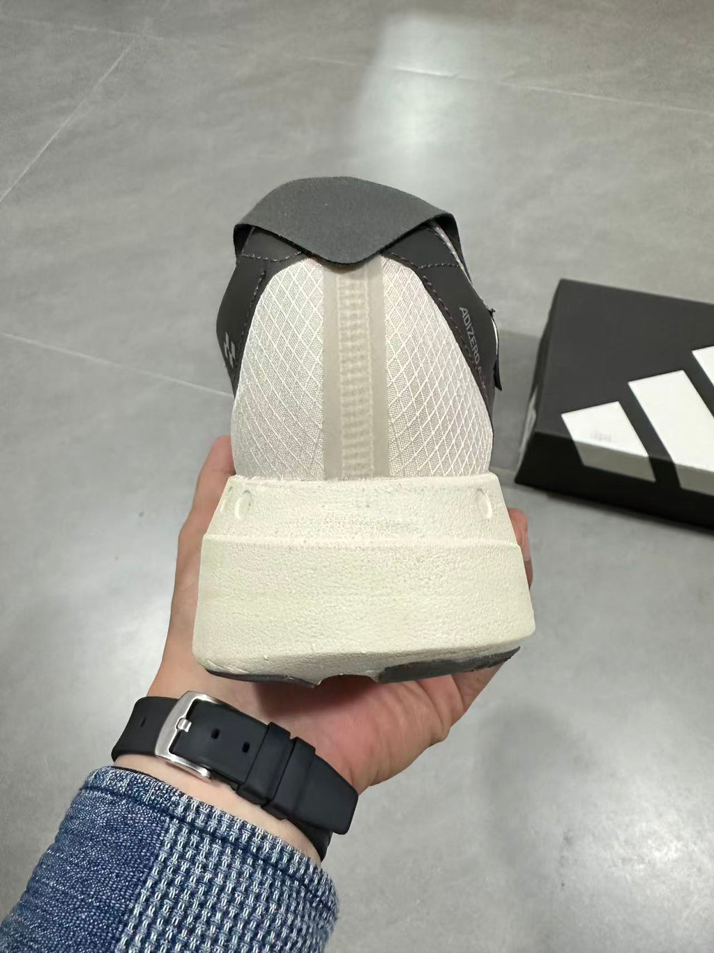 adidas Adizero Adios Pro 4 Running Shoes in White Black - product image from the listing.