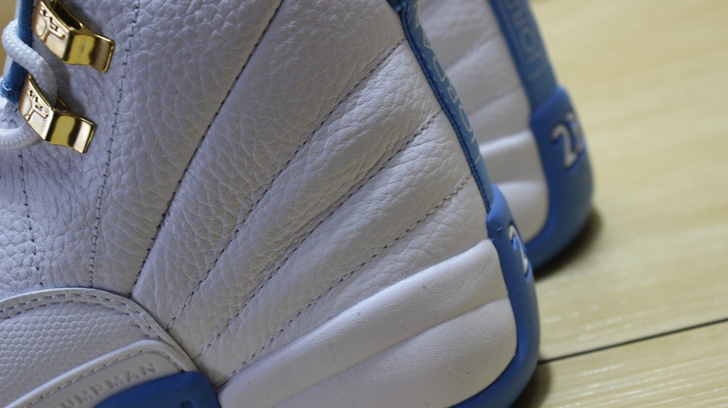 Air Jordan 12 High-Top Sneakers in University Blue 510815-127 - product image from the listing.