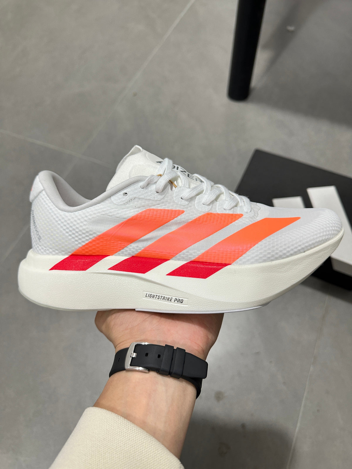 Adidas Adizero EVO SL Running Shoes in White Orange - product image from the listing.