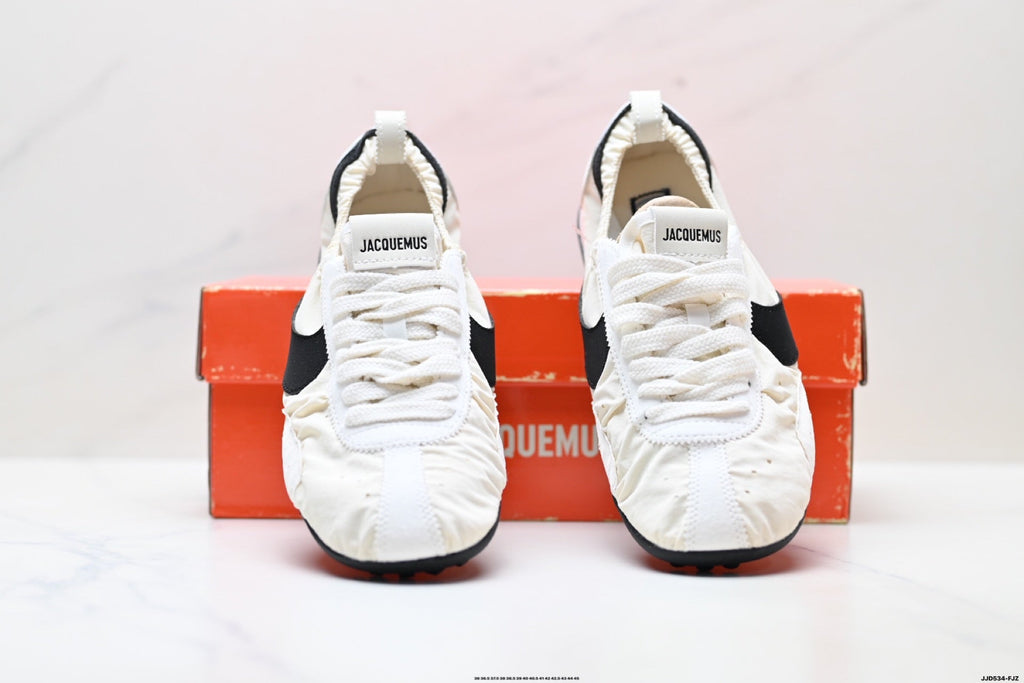 Jacquemus x Nike Jacumoon Low-Top Sneakers, in White and Black - product image from the listing.