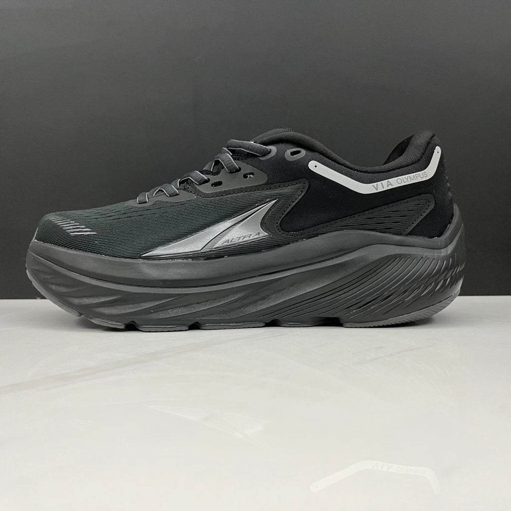 Altra Via Olympus Running Sneakers in Black - product image from the listing.