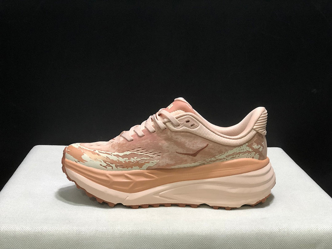 HOKA Stinson 7 Trail Running Shoes in Blush and in Cream - product image from the listing.