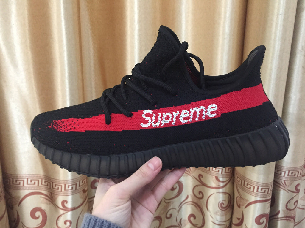 Yeezy 350 V2 Sneakers in Black and Red Knit - product image from the listing.