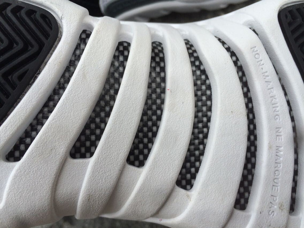 Women's Air Jordan 12 High-Top Sneakers, Black and White - product image from the listing.