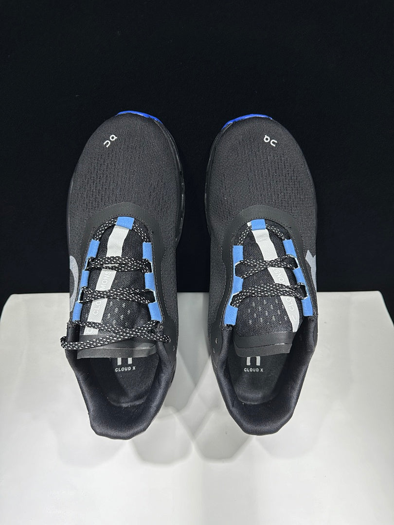 On Cloudmonster Cloud X Sneakers in Black Purple Blue - product image from the listing.