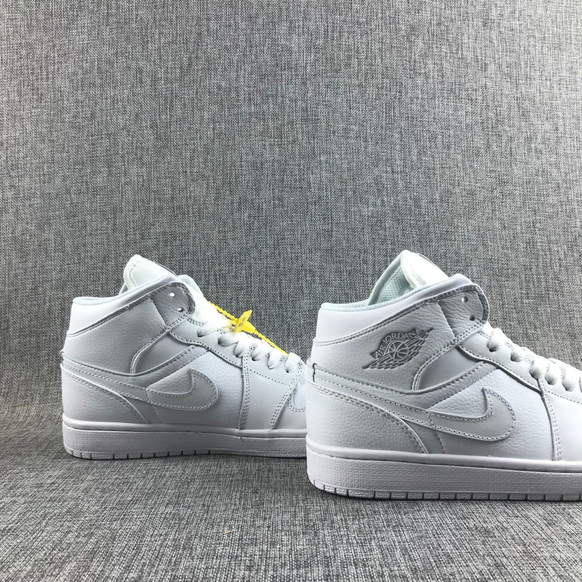 Air Jordan 1 Mid Sneakers in White - product image from the listing.
