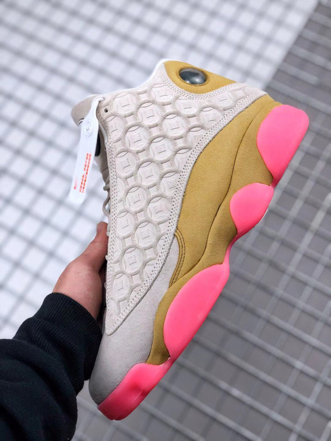 Air Jordan 13 CNY Sneakers in White, in Gold and Pink - product image from the listing.