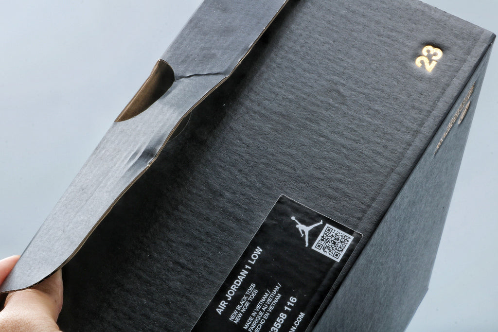 Jordan 1 Low Black Toe Sneakers in Black White Red - product image from the listing.