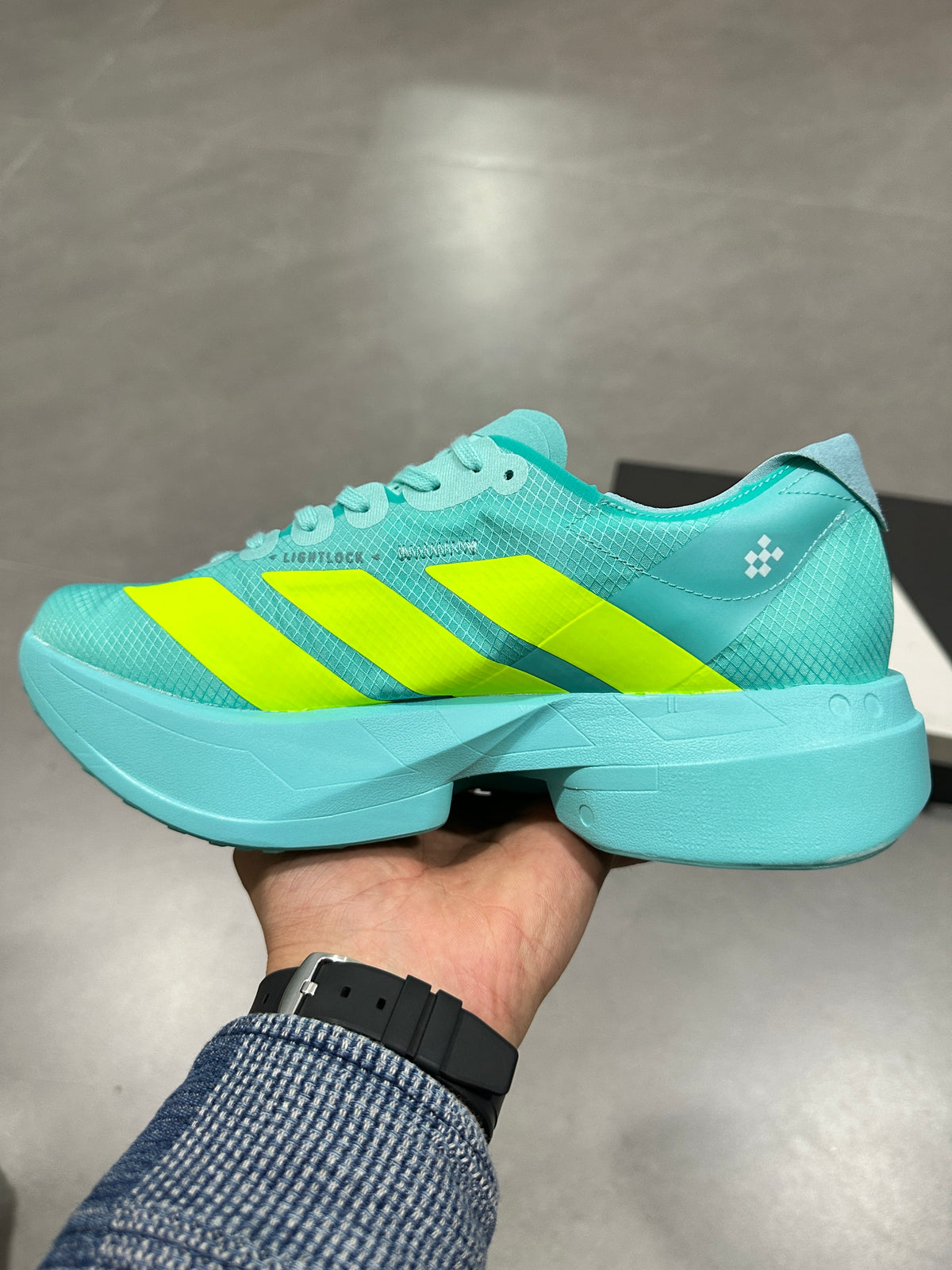 Aqua and Volt Nike Lightstrike Pro Running Shoes - product image from the listing.