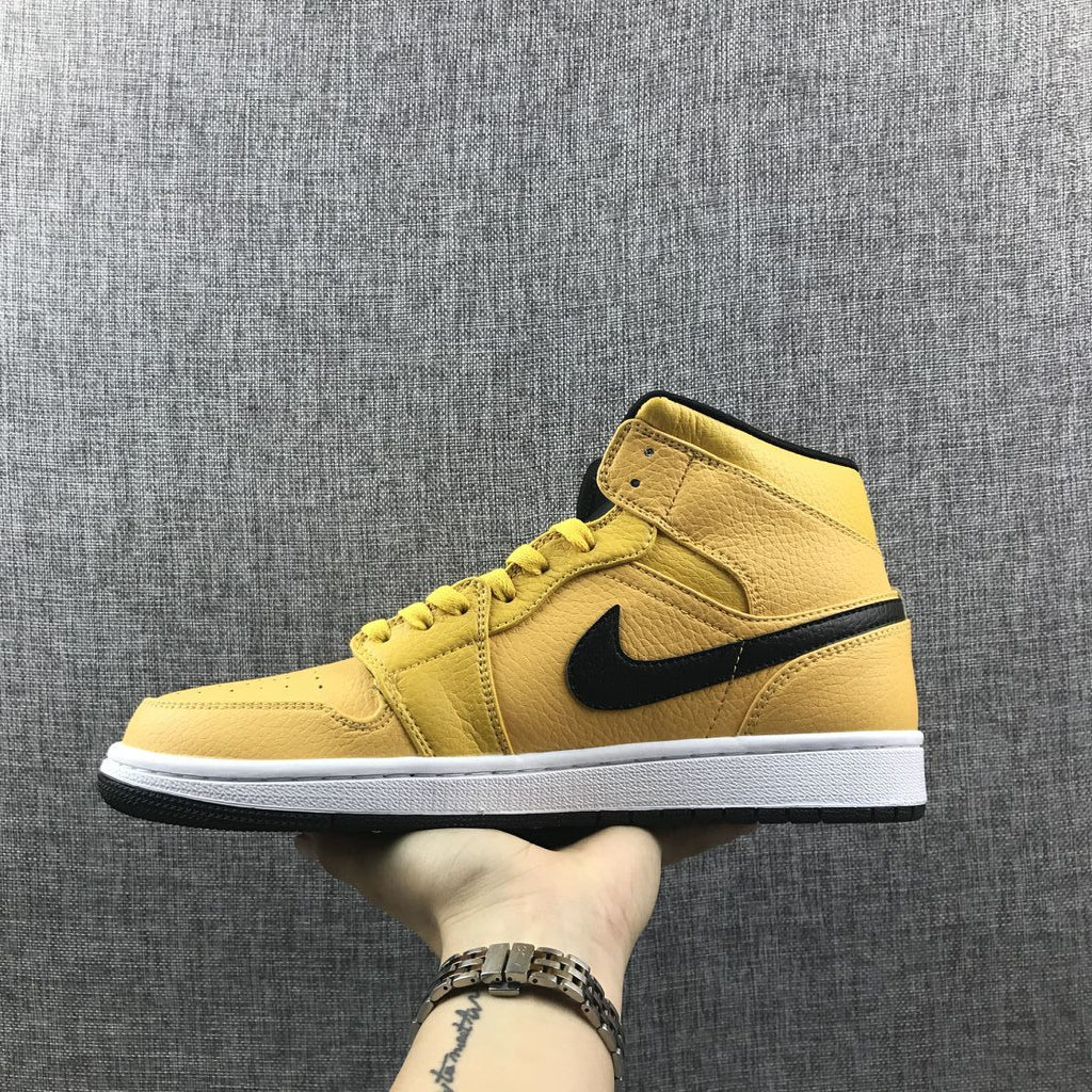 Air Jordan 1 Mid Yellow Ochre Sneakers in Black 554724-700 - product image from the listing.