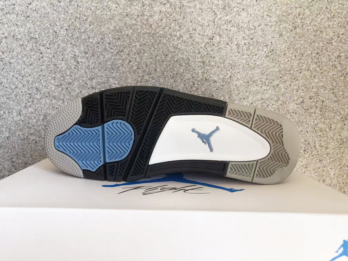 Jordan 4 Retro Sneakers in University Blue - product image from the listing.