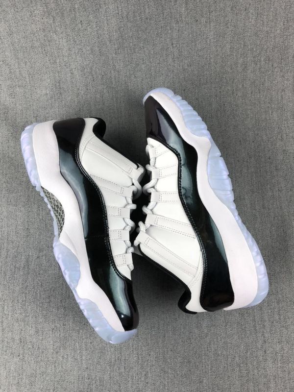 White and Black Jordan 11 Low Sneakers - product image from the listing.