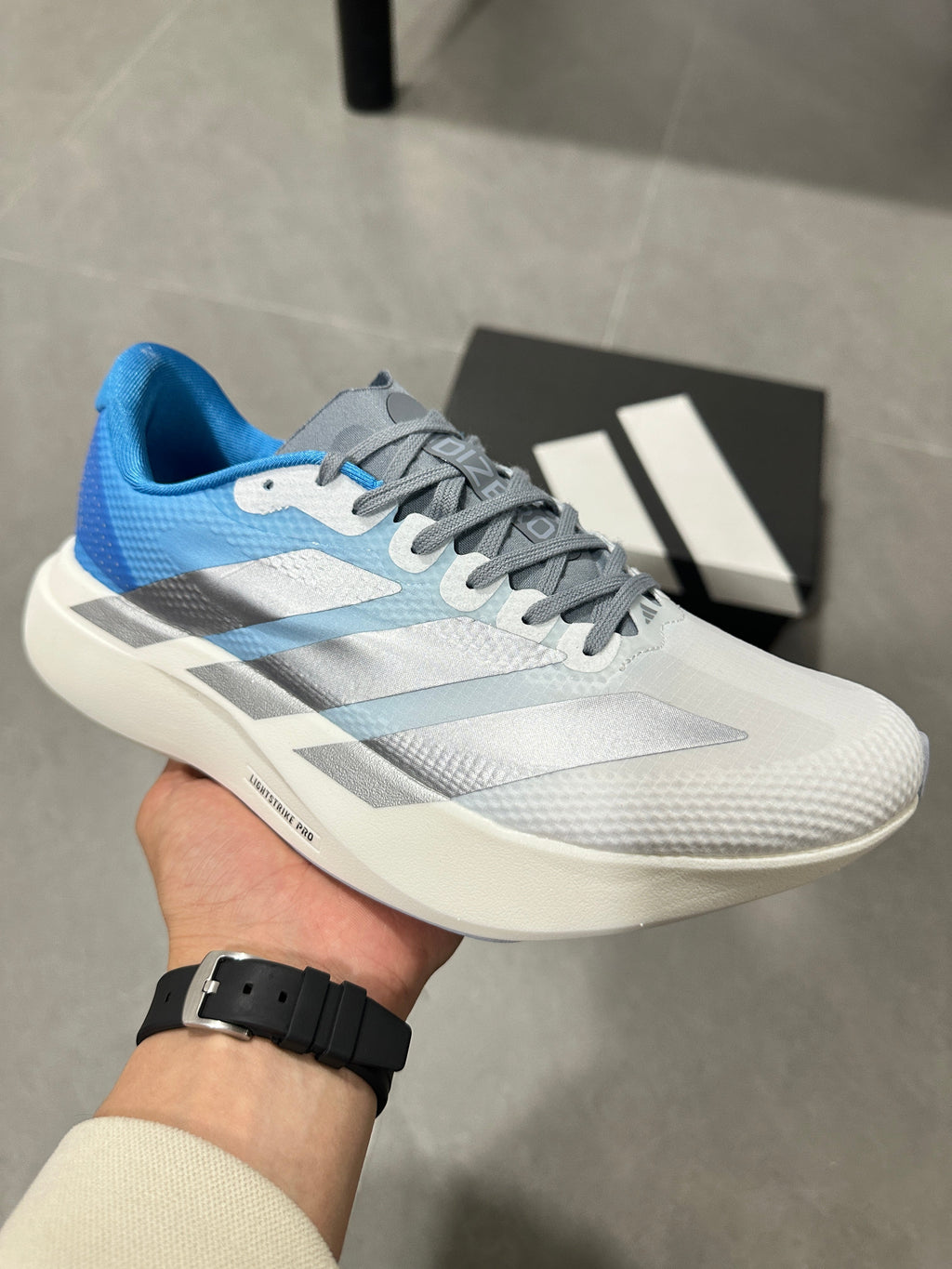adidas Adizero EVO SL Running Shoes in White Blue JR2027 - product image from the listing.