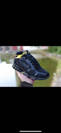 Nike Air Max Black and Yellow Running-Style Trainers - product image from the listing.