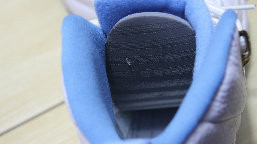 Air Jordan 12 High-Top Sneakers in University Blue 510815-127 - product image from the listing.