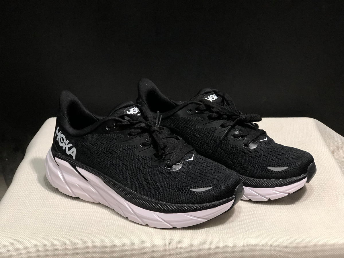HOKA Clifton 8 Running Shoes, in Black and White - product image from the listing.
