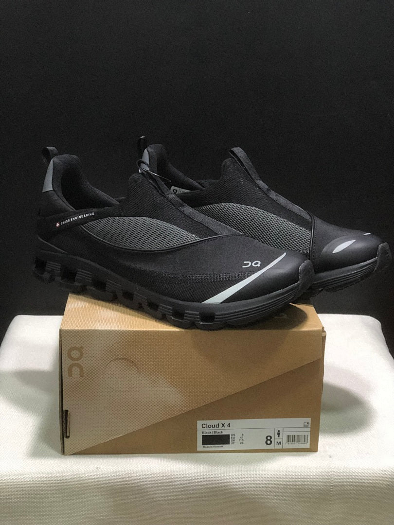 On Cloud 4 Coast Black Slip-On Trainers - product image from the listing.