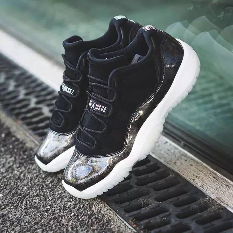 Jordan 11 Retro Low Barons Sneakers in Black White - product image from the listing.