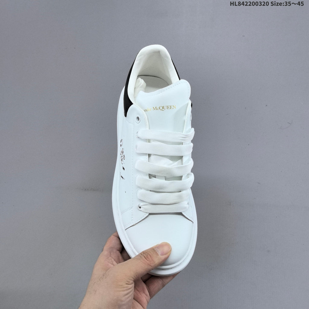 Alexander McQueen Oversized Low-Top Sneakers, in White and Black - product image from the listing.