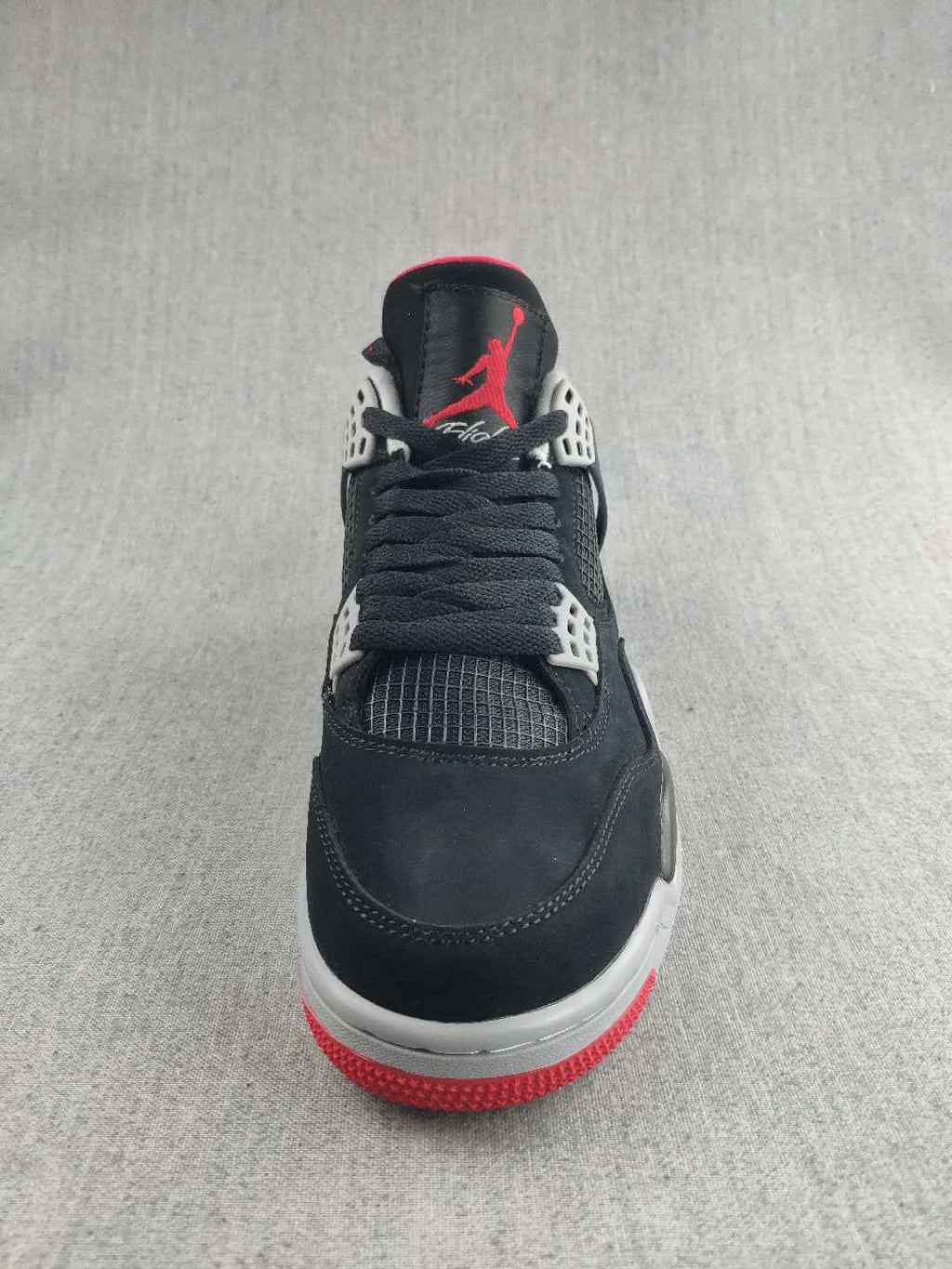 Jordan 4 Retro Sneaker in Black, in Red and White - product image from the listing.