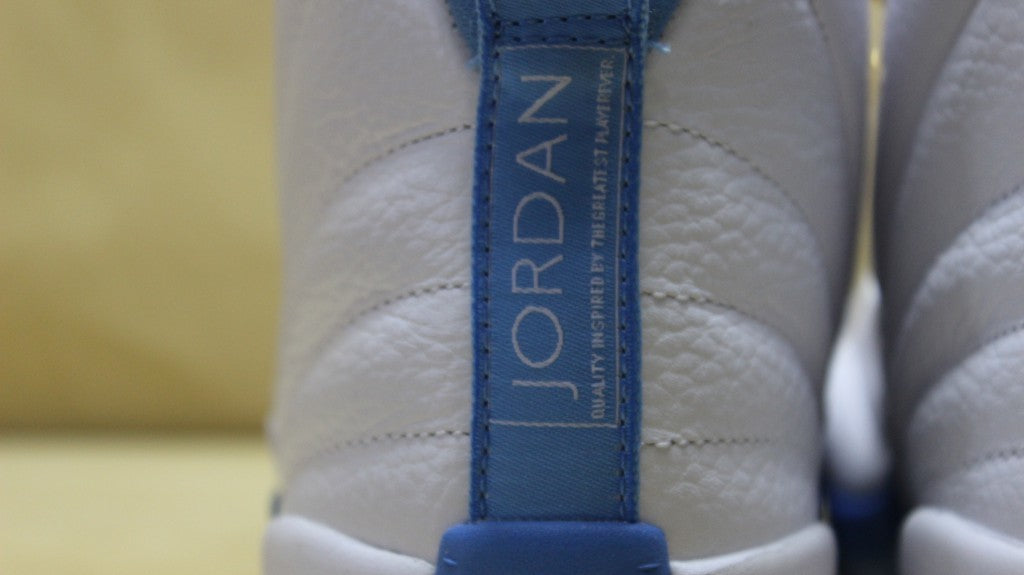 Air Jordan 12 High-Top Sneakers in University Blue 510815-127 - product image from the listing.