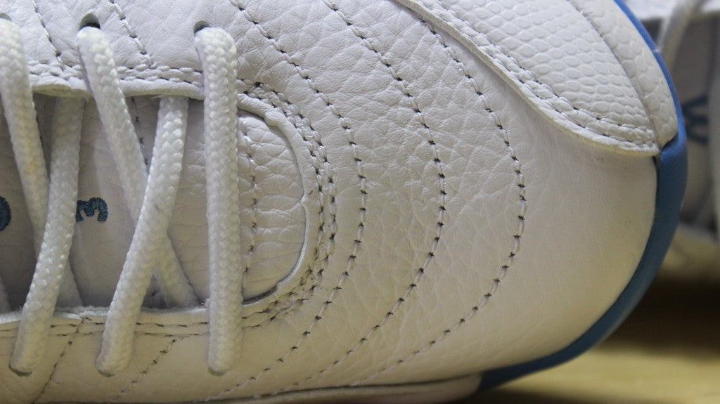 Air Jordan 12 High-Top Sneakers in University Blue 510815-127 - product image from the listing.