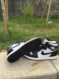 Jordan 1 High Sneakers in Black and White - product image from the listing.