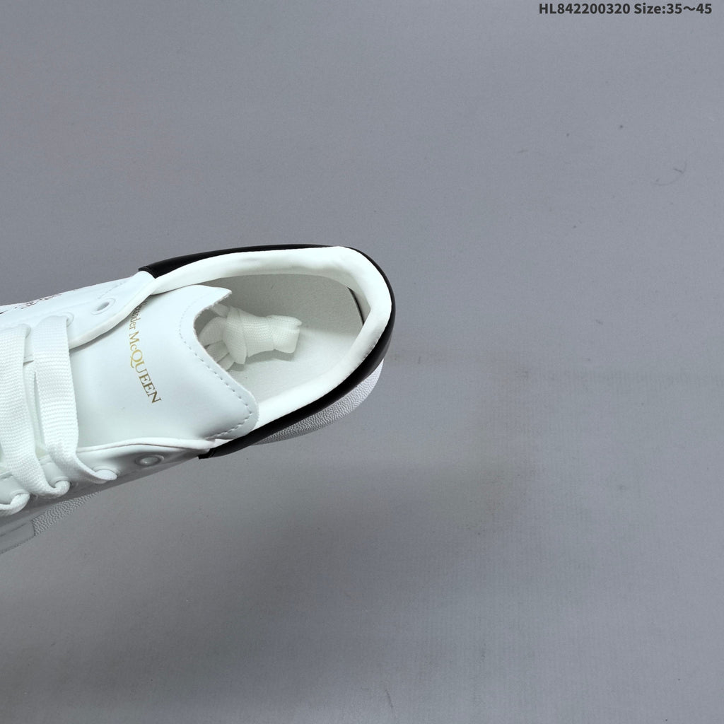 Alexander McQueen Oversized Low-Top Sneakers, in White and Black - product image from the listing.