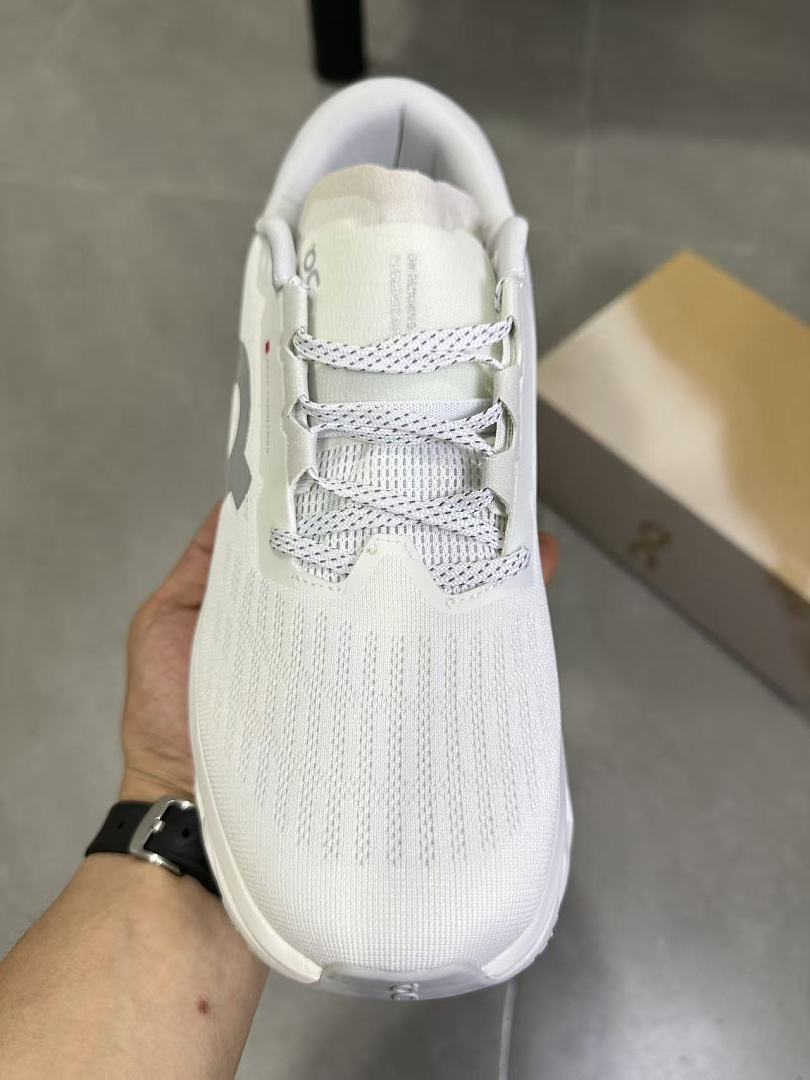 On Running Running Sneakers in White and Gray - product image from the listing.