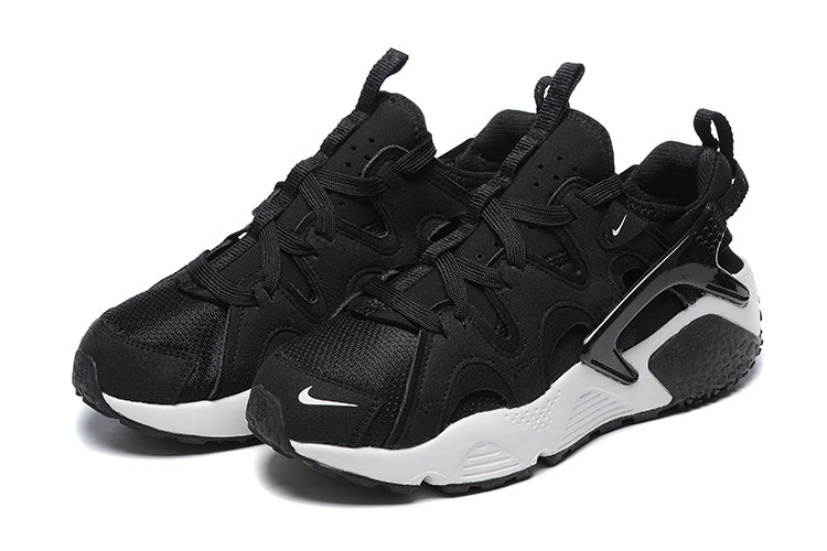 Nike Air Huarache Sneakers in Black and White - product image from the listing.