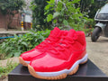 Air Jordan 11 Retro in Red - product image from the listing.