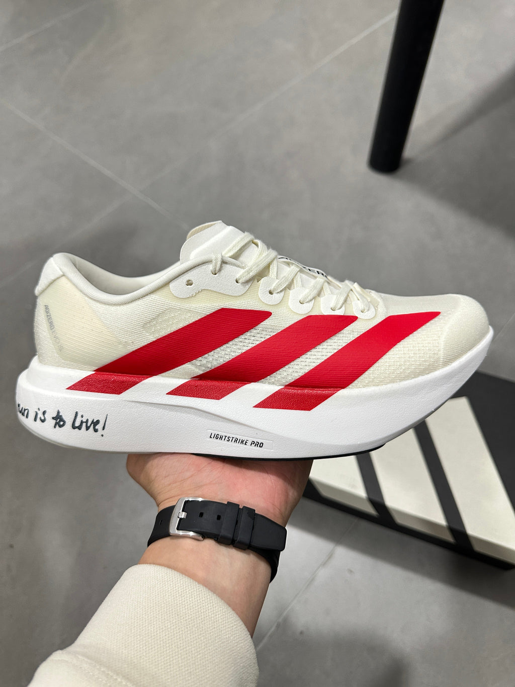 adidas Adizero Lightstrike Pro Running Shoes in White Red - product image from the listing.