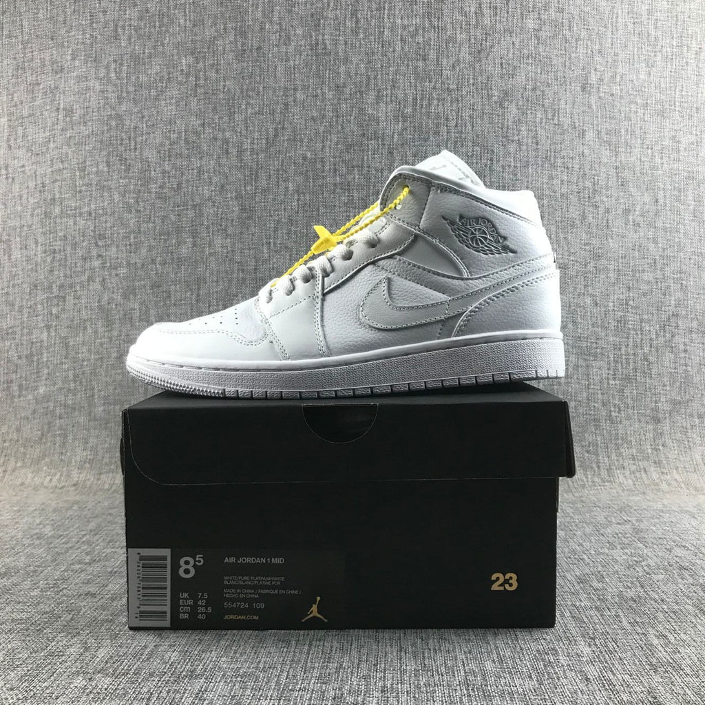 Air Jordan 1 Mid Sneakers in White - product image from the listing.