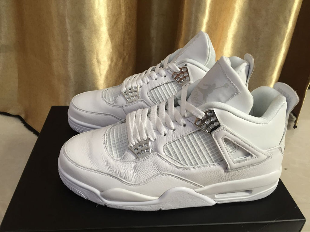 Air Jordan 4 Retro White High-Top Sneakers - product image from the listing.