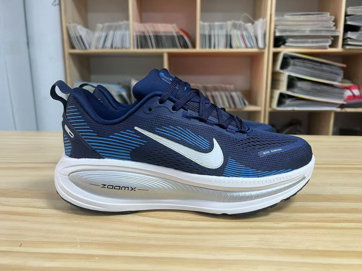 Navy and Blue Nike Vomero 18 Running Shoes - product image from the listing.