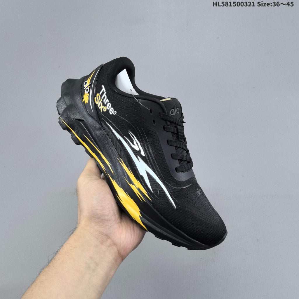 Alo Yoga Alo Runner Graphic Running Sneakers, in Black - product image from the listing.