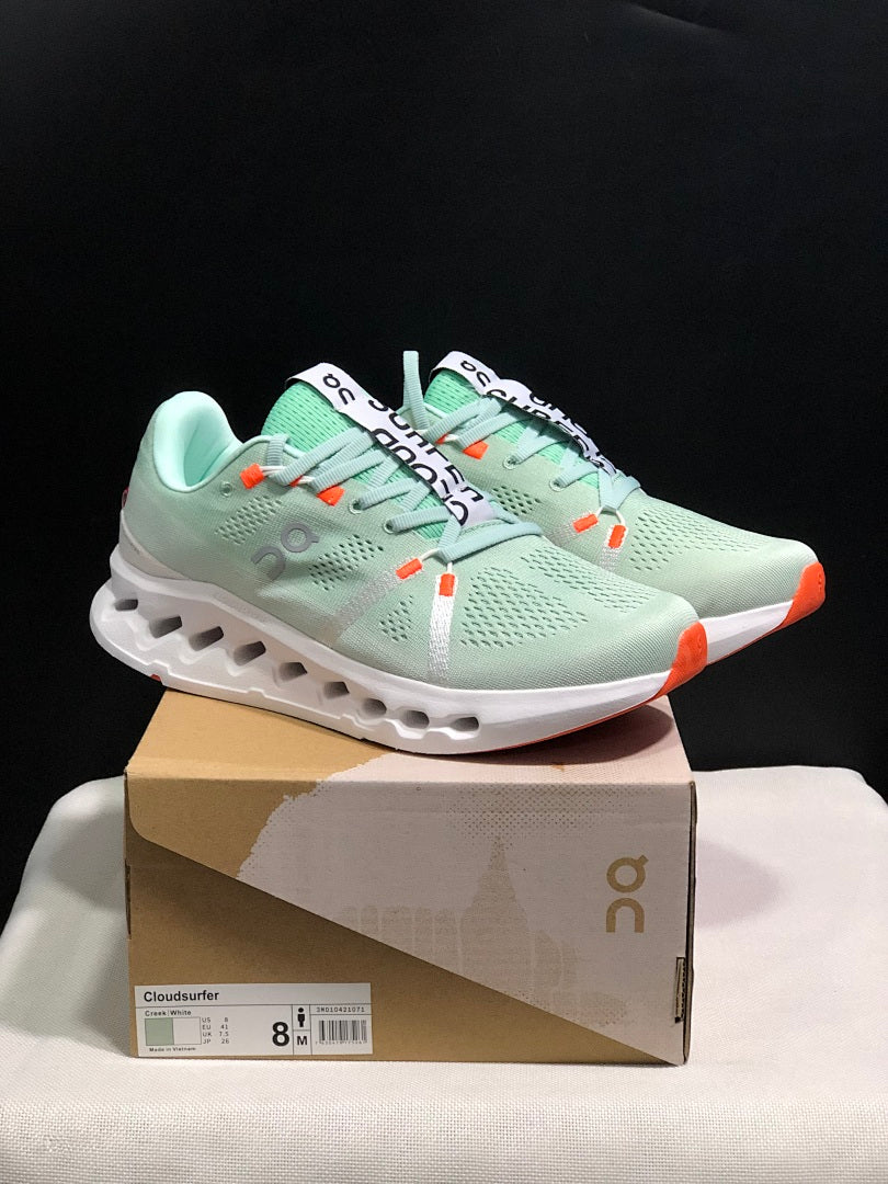Pale Green and White On Cloudsurfer Sneakers - product image from the listing.