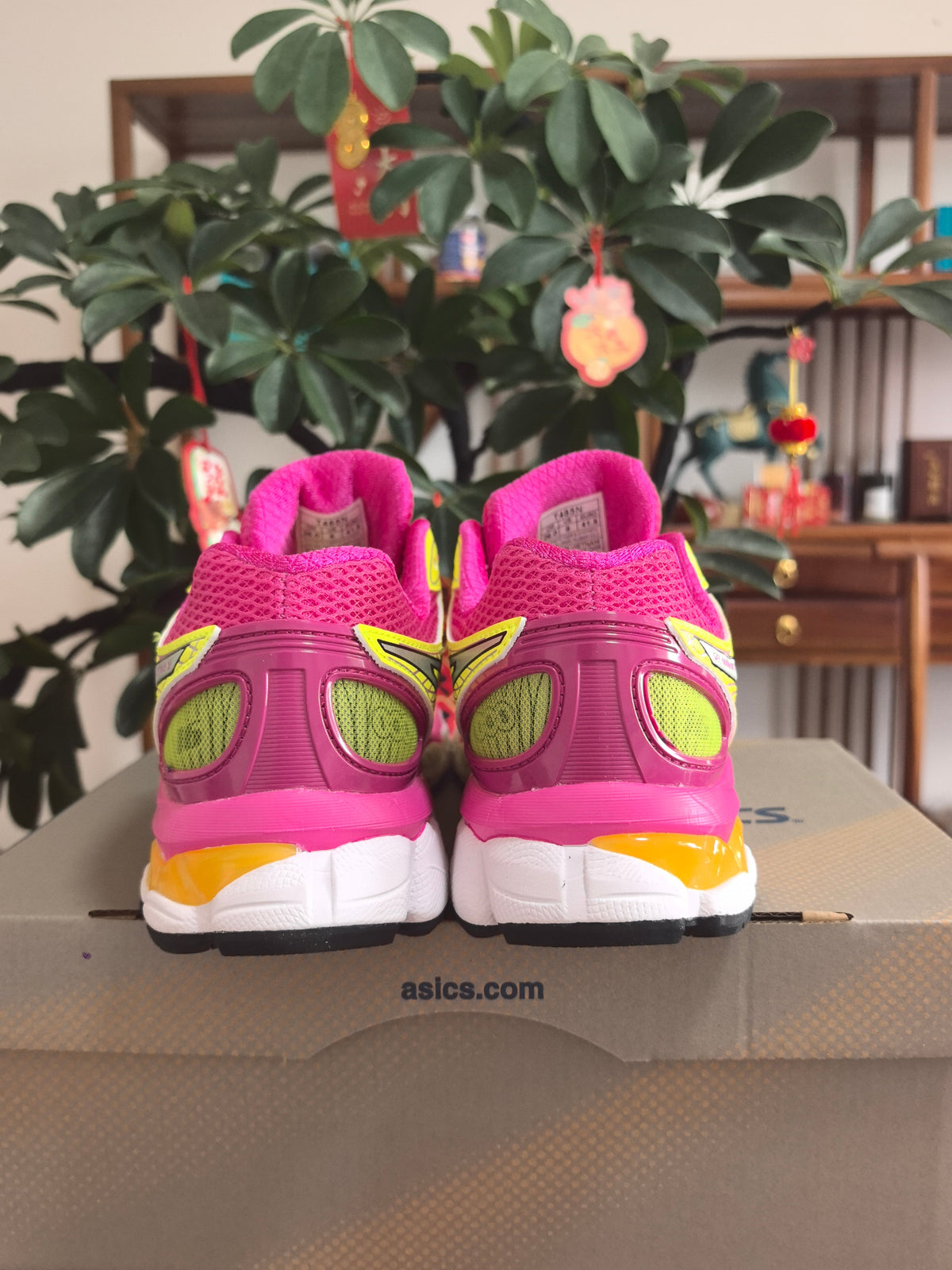Pink and Lime ASICS GEL-Nimbus 16 Sneakers - product image from the listing.