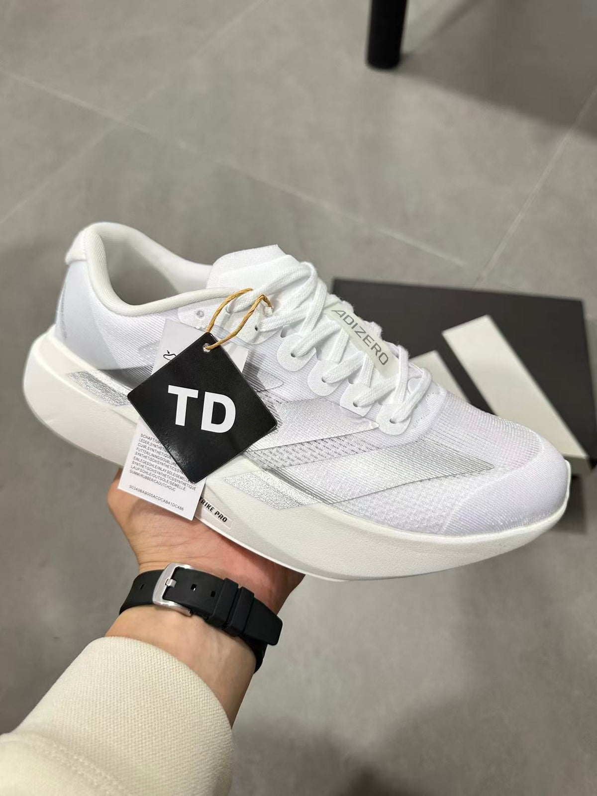 adidas Lightstrike Pro Running Shoes in White JR6207 - product image from the listing.